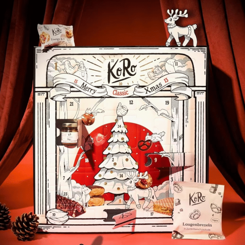 KoRo Adventskalender 2025 mit 24 veganen Bio-Snacks in edler Geschenkbox für gesundheitsbewusste Genießer:innen.