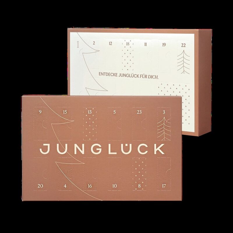 JUNGLÜCK Adventskalender 2025 mit 24 veganen Naturkosmetik-Minis, Bestseller-Seren und Gutschein in limitierter Box.