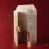 Catrice Adventskalender 2026 geoeffnete Hausbox dreidimensional im Ambiente