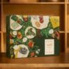 L'Occitane Adventskalender 2026 geöffnet mit Pflegeprodukten auf einem Holztisch