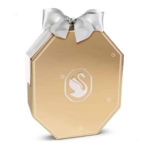 Swarovski Adventskalender 2026, geschlossenes achteckiges Etui in Champagnerton mit weißem Ripsband, Artikelnummer 5732493