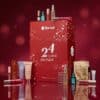Flaconi Adventskalender 2026 Beauty-Produkte auf rotem Hintergrund mit Dyson und Kérastase