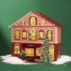mymuesli Adventskalender als XXL-Haus mit Weihnachtsbaum und Schnee