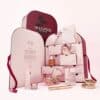 Sculpted By Aimee Beauty Adventskalender 2026 geöffnet, alle 12 Produkte auf rosa Hintergrund