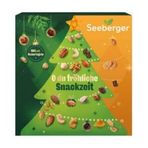 Seeberger Adventskalender 2026, Verpackung mit Weihnachtsbaum und Hinweis NEU mit Nussriegeln